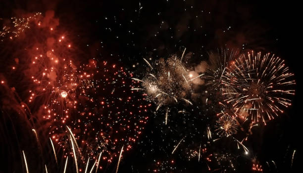 istock Colorful bright fireworks isolated on a black background. 1320516841