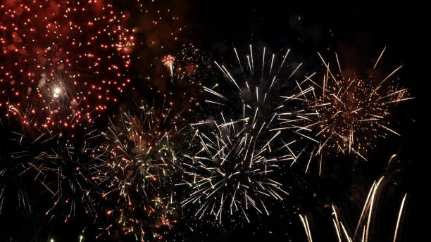 istock Colorful bright fireworks isolated on a black background. 1320516922
