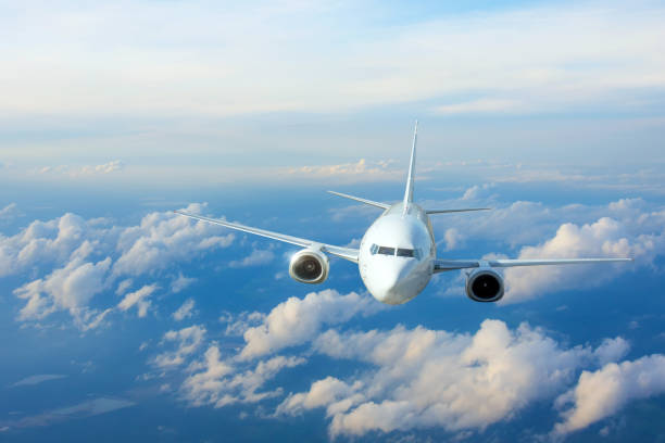 istock Passenger plane, business trip, travel concept. Flying evening before sunset. 1320517097