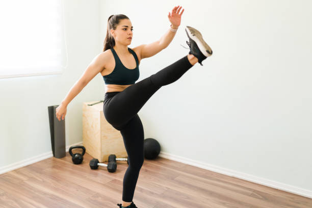 istock Sporty woman sweating with a HIIT session 1320519575