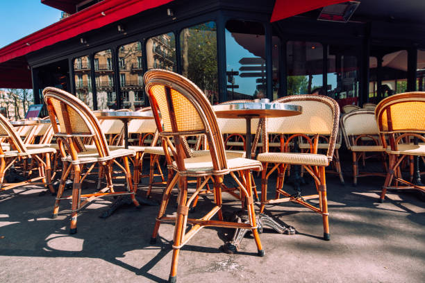 istock Empty chairs in a restaurant on the streets of Paris 1320519640