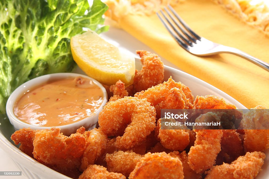 Shrimp meal. Deep fried shrimp platter, also known as popcorn shrimp. Also available in vertical.  Shrimp - Seafood Stock Photo