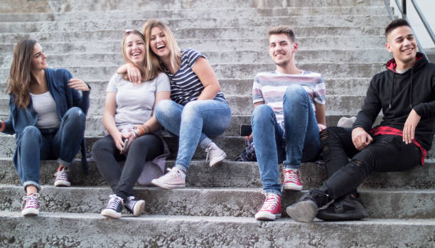 istock Young students friends hang out outside 1320522751
