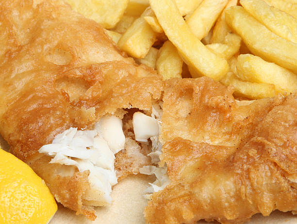 Close up of fried fish and French fries stock photo
