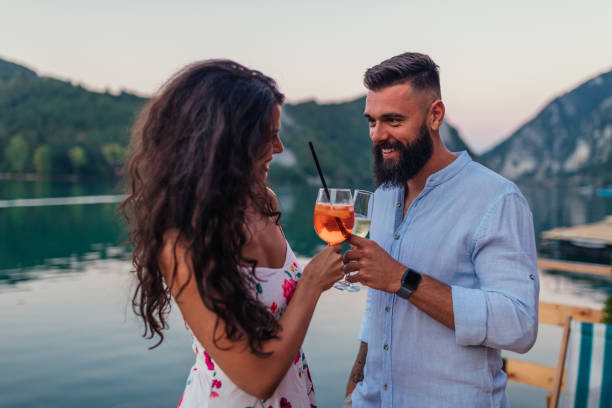 istock Couple celebrating outdoors with wine 1320525229