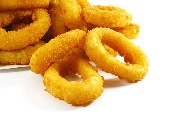 istock Close-up of crispy onion rings on white background 132052524