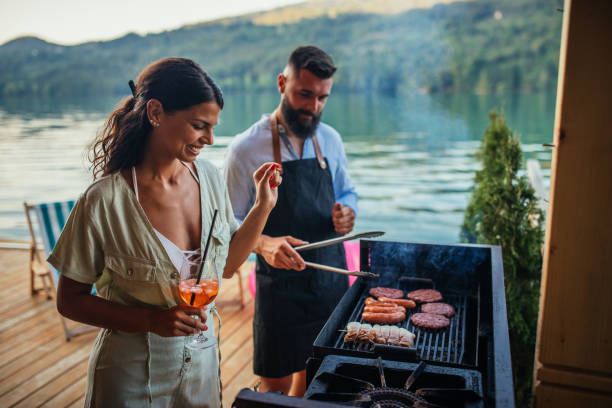 istock Couple grilling outdoors 1320525244