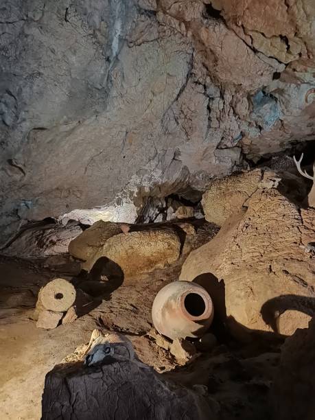 istock Underground mountain cave with river and stalactites and stalagmites 1320526503