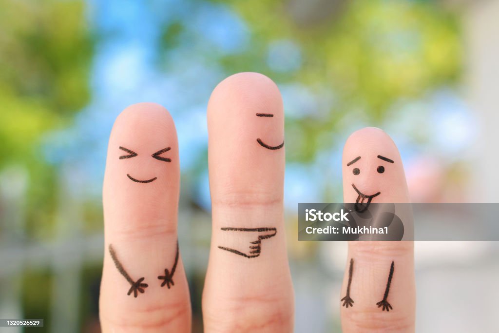 Fingers art of happy family. Concept of child makes face and parents laugh. Humor Stock Photo