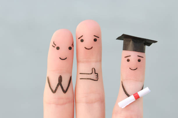 fingers art of happy family. concept parents are proud of their child graduated from college. - accolade imagens e fotografias de stock