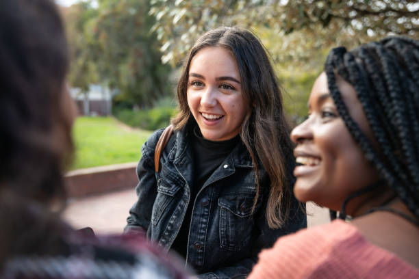 istock Young adults socializing on campus 1320527260