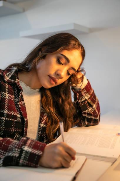 istock Yound adult studying at home 1320527485