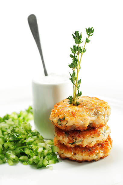 istock Serving of salmon steaks with fresh cucumber 132052762