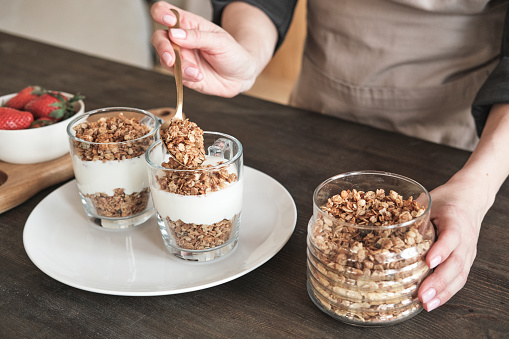 Preparing granola for breakfast