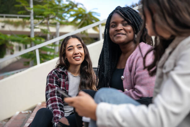 istock Young adults socializing on campus 1320527810