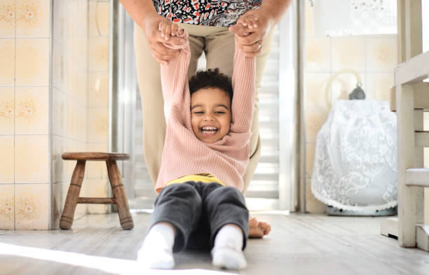 istock Playing on the floor with auntie 1320530011