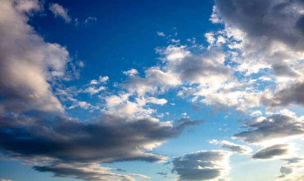 istock Fluffy white and gray clouds on blue sky background. Copy space. 1320536496