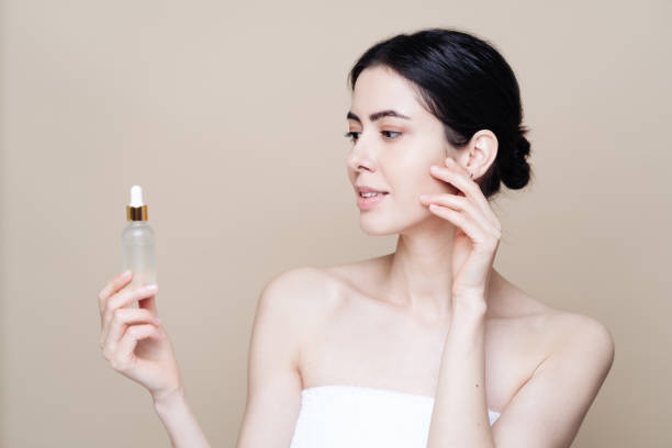 istock Caucasian woman holding bottle with serum 1320536953