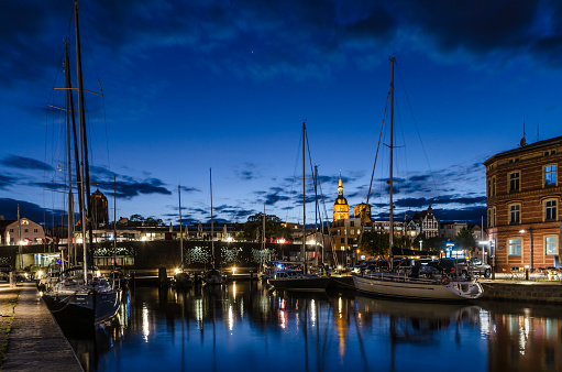 Evening atmosphere in the marina of Stralsund with a view of the silhouette of the old town.