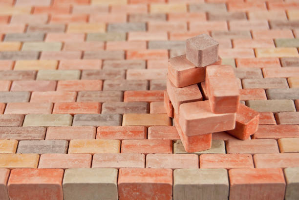 istock Colorful bricks on a pile. Brick texture close up. The blocks are stacked on brick paving. Copy space and free space near the brick. 1320540045