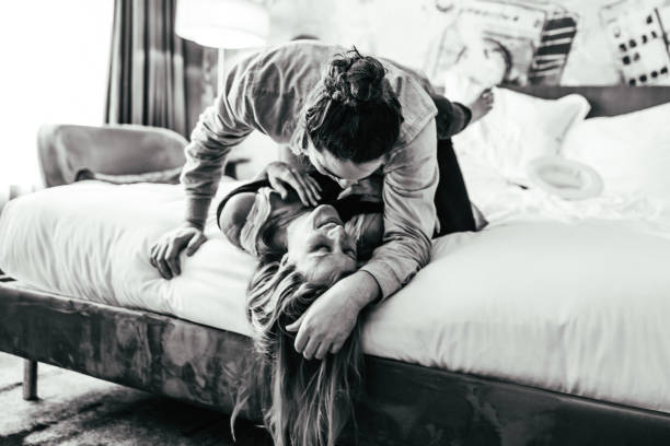 istock Couple Getting Romantic in the Hotel Room 1320540090