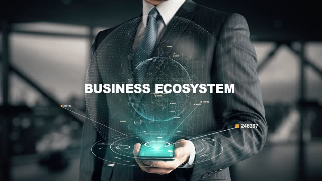 Businessman with Business Ecosystem hologram concept