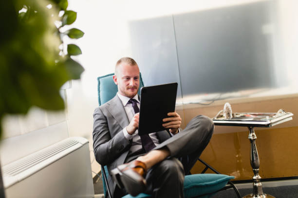 istock Businessman having video meeting in his modern office 1320542381