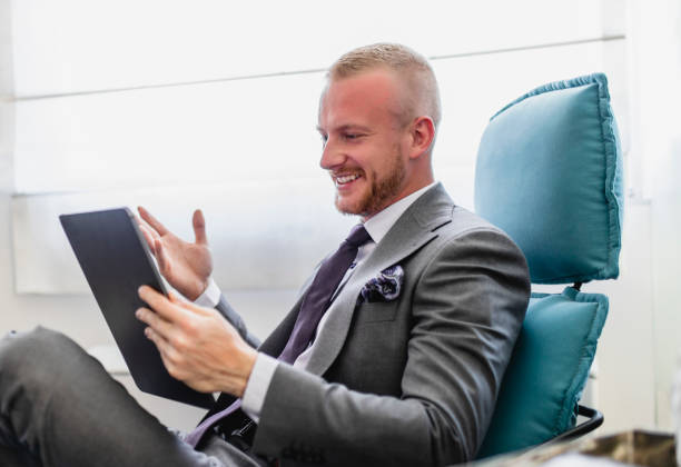 istock Businessman having video meeting in his modern office 1320543037