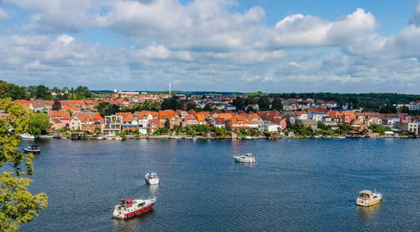 Malchow in the Mecklenburg Lake District View from Malchow Abbey on Lake Malchow with houseboats in front of the island town of Malchow in the Mecklenburg Lake District. mecklenburg lake district photos stock pictures, royalty-free photos & images
