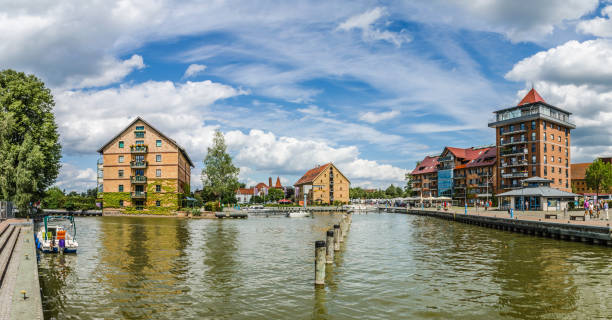 Port of Neustrelitz in summer The harbour basin of Neustrelitz in the Mecklenburg Lake District with typical warehouses. muritz national park photos stock pictures, royalty-free photos & images