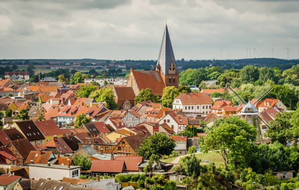 View of the historic city center of Röbel View of the old town of Röbel in the Mecklenburg Lake District with the Nicolaikirche, windmill and historic houses. muritz national park photos stock pictures, royalty-free photos & images