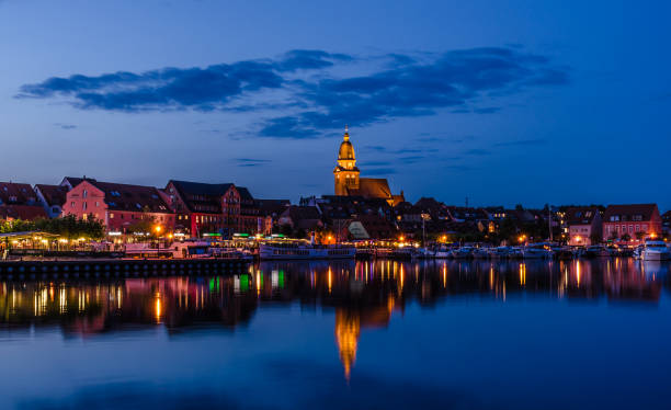 Blue hour in Waren an der Müritz Panoramic picture of the harbour and the old town of Waren an der Müritz in the Mecklenburg Lake District at the Blue Hour in the evening. muritz national park photos stock pictures, royalty-free photos & images