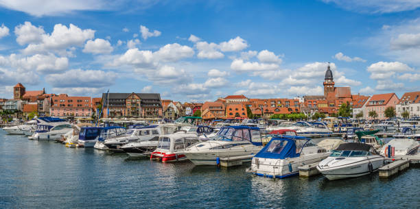 Panorama of waren an der Müritz with harbour Panoramic picture of the harbour of Waren on the Müritz with the old town in the background. mecklenburg lake district photos stock pictures, royalty-free photos & images