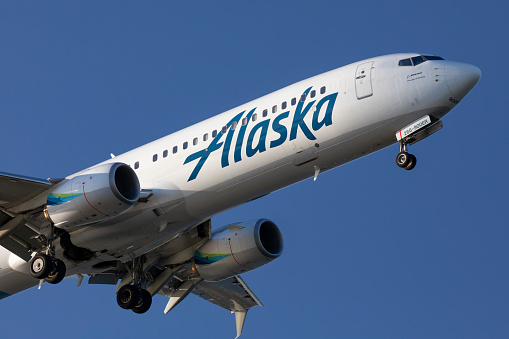 Portland, Oregon, USA - April 16, 2021:  An Alaska Airlines Boeing 737 on approach to Portland International Airport.