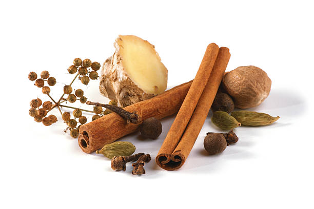 Christmas gingerbread spices Christmas gingerbread spices - clove, nutmeg, cinnamon, allspice, coriander, cardamom, ginger isolated on white background. Shallow DOF. Focused on the front. cinnamon sticks cloves stock pictures, royalty-free photos & images