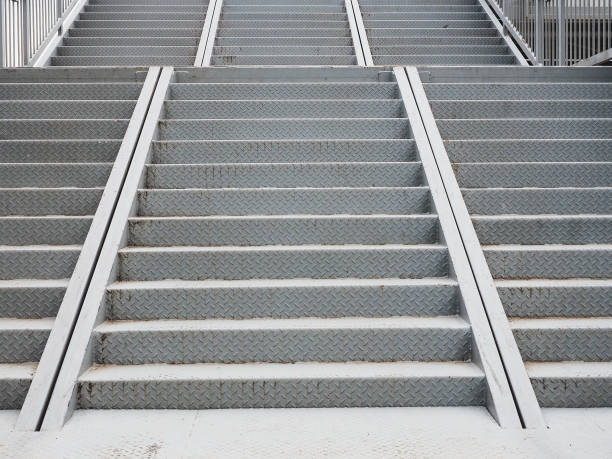 istock Gray, patterned triple iron steps lead up to the bridge. Full screen photo 1320547307