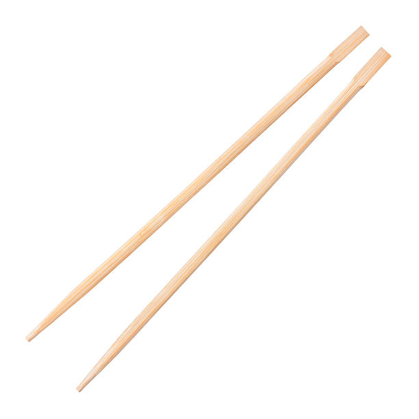 istock Two wooden chopsticks isolated against a white background 132054994