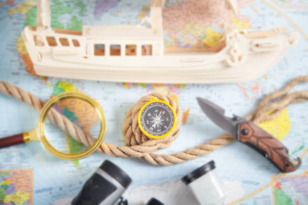 istock World map, ship, compass, rope, binoculars, knife. Travel 1320550360