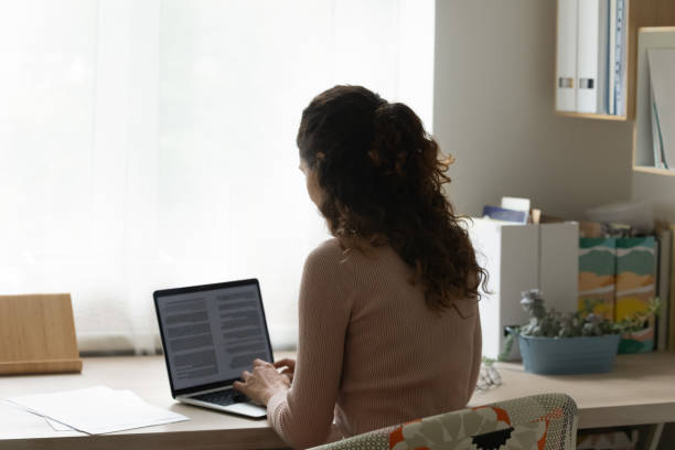 istock Young woman working on computer at home office. 1320550744
