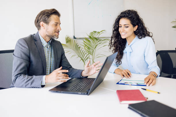 istock Two middle-aged people are working on a new business 1320555390