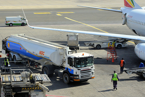 Addis Ababa, Ethiopia: National Oil Ethiopia/ NOC Aviation fuel truck refuels an Ethiopian Airlines Boeing 737-800 - Addis Ababa Bole International Airport.