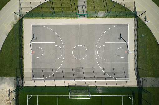 High angle aerial view of basketball playground court on the street