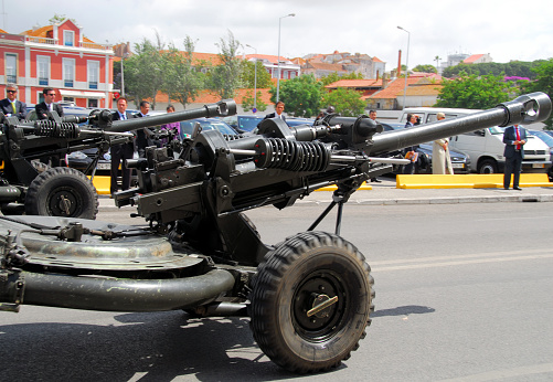Setubal, Portugal: pair of L118 Light Gun 105 mm towed howitzers aka M119 (US version) - military parade.