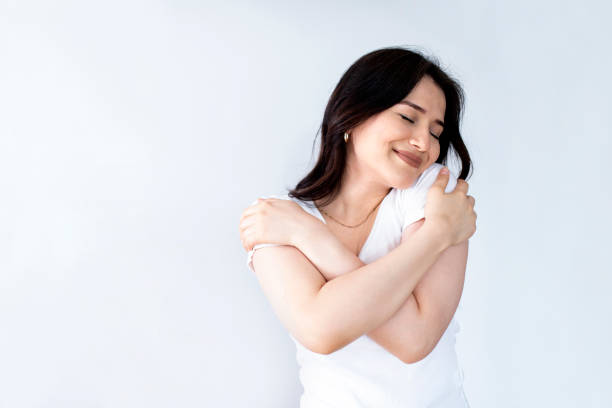 istock woman love herself looking to mirror 1320558840
