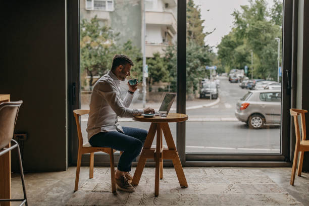 Young attractive man in the coffee shop