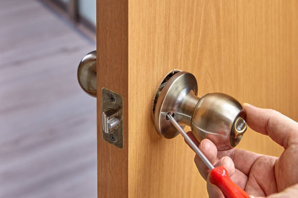 Assembly of lock with handles and latch for an interior door. Assembling lock with door knobs and latch in living room. doorknob stock pictures, royalty-free photos & images