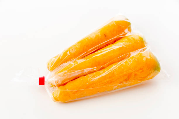 istock Kinbininjin, yellow carrot in plastic bag on white background 1320564242