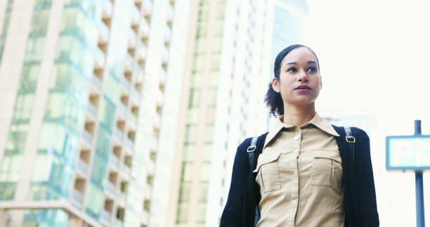 istock Young mixed race businesswoman on her way to work walking with confidence 1320564251