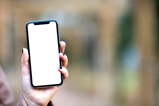 istock A hand holding black mobile phone with blank desktop screen 1320565136