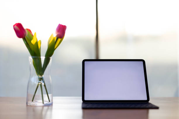 istock Laptop with white blank screen display and office equipment 1320565144